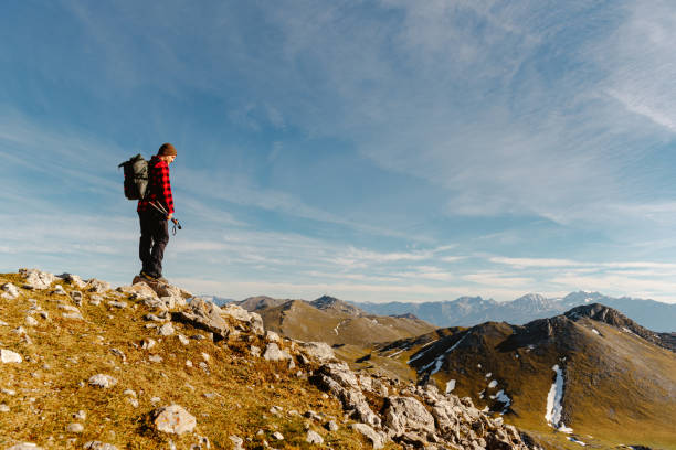 istock man hiking alone in the mountains 1482643237