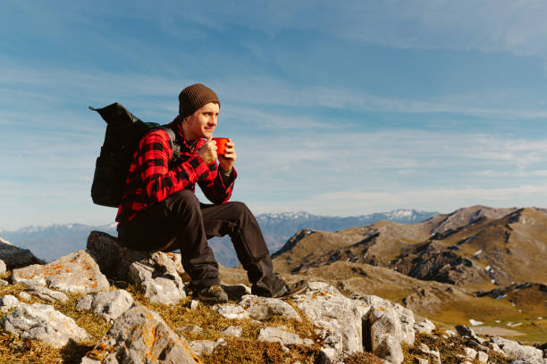 istock man hiking alone in the mountains 1482643244