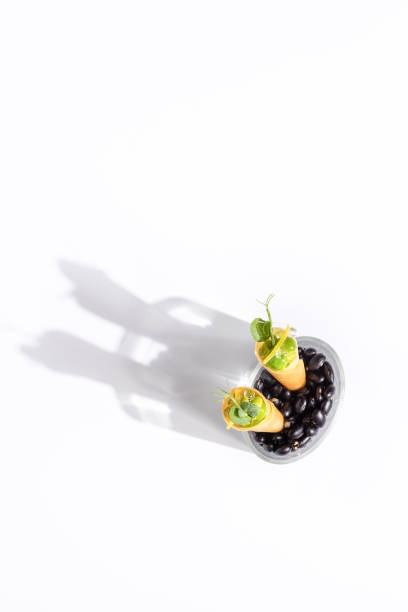 Vegan Canapé Appetizer Amuse Bouche food with peas and lime jelly at Michelin Star Restaurant stock photo