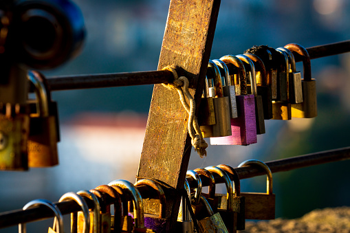 A Symbol of Love: The tradition of attaching lovelocks to a bridge fence as a symbol of a couple's unwavering love and affection for each other