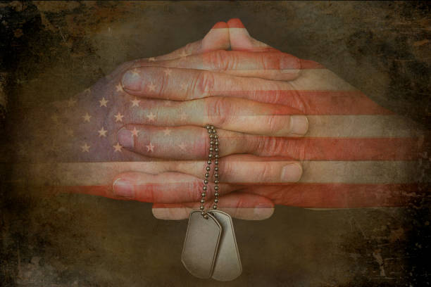 istock Praying Hands with Flag and Dog Tags 1482645076
