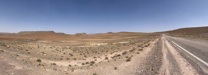 Morocco: view of the panoramic and desert road to Ait Benhaddou, historic fortified village along the former caravan route between the Sahara and Marrakesh used as set for movies and tv series