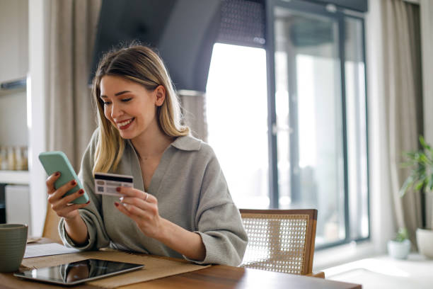 istock Happy young woman shopping online 1482650231