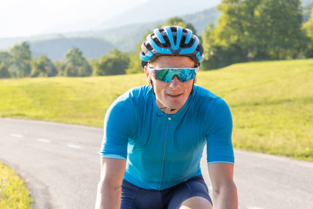 istock Male athlete riding a racing cycle 1482650251