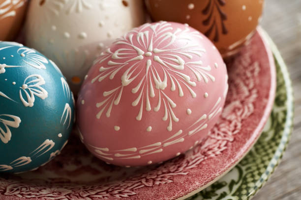 Easter egg decorated with ribbon. Shallow depth of field with focus on ribbon bow.