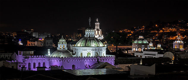 Quito city center at night with illuminated Compania de Jesus church, Quito, Ecuador.