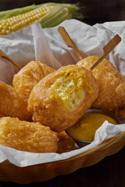 Beer Battered Corn on the Corn Beer Battered Corn on the Corn with Spicy Mustard Dip corn cob eaten stock pictures, royalty-free photos & images