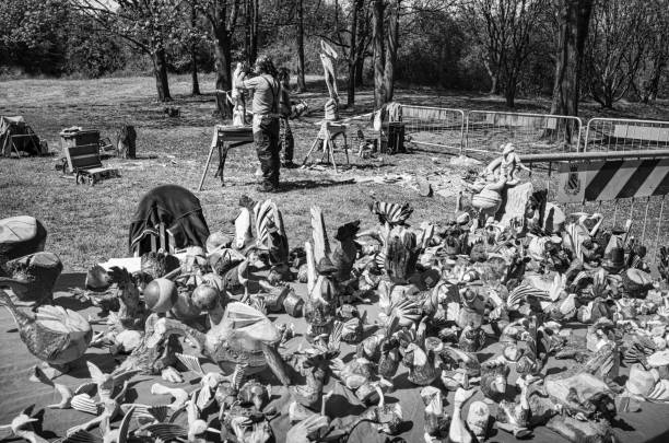 Seveso, Italy - April 16, 2023: wood carvers during a demonstration in a park