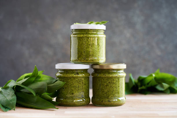 istock Bottled wild garlic pesto with fresh ramson leaves 1482654488