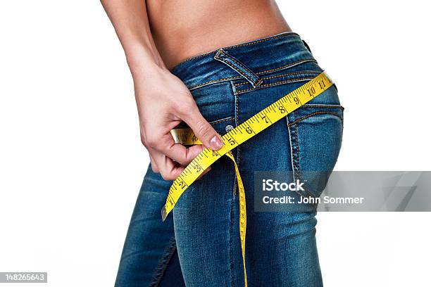 Woman Hearing Her Hips Stock Photo - Download Image Now - Buttocks, Curve, Jeans