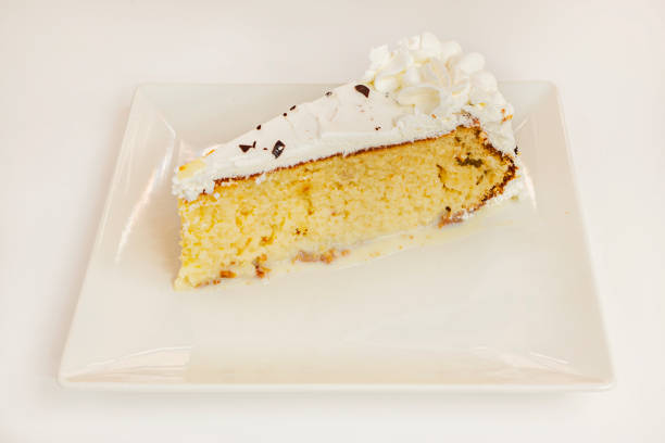 Coconut cream pie on a wooden table.