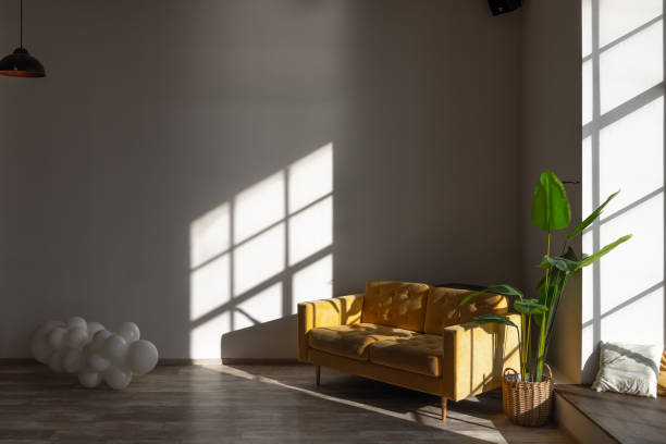 istock sofa on background of shadows from window 1482659363