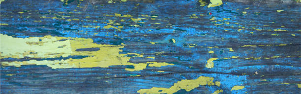 istock Aged wooden board painted blue and yellow 1482661451