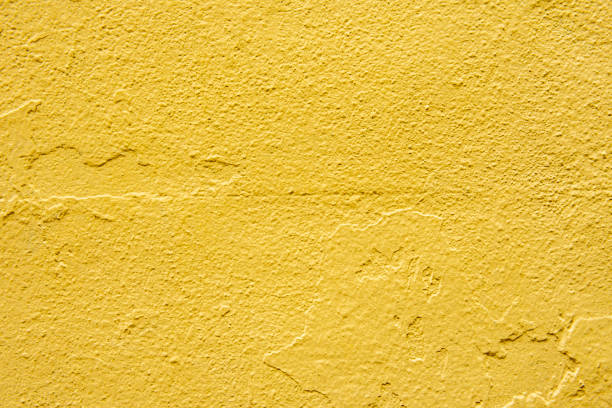 istock Concrete wall painted over and over again, the last one yellow. Vector paint texture background 1482661492