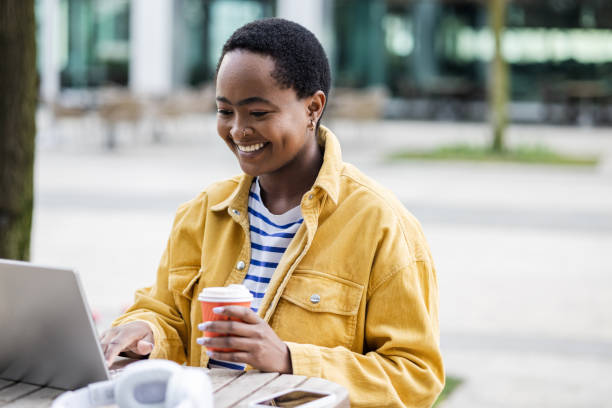 istock A young Black woman is attending online classes in the cafeteria 1482664960