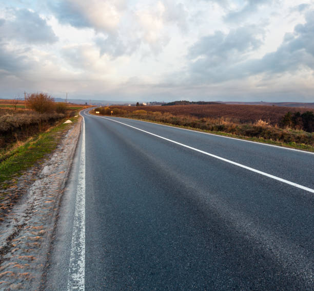 istock Road through the spring morning fields and countryside. 1482666476
