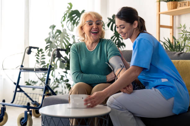 istock Happy elderly woman getting her blood pressure measured during regular visit 1482675391