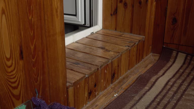 Man Stepping Over a Threshold. Enters from room to balcony. Domestic life