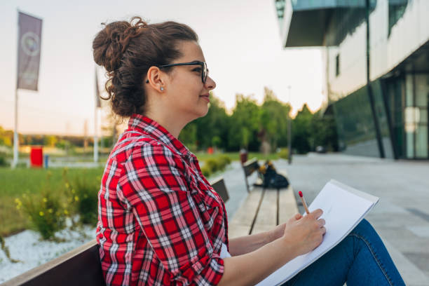istock A young woman is drawing outside 1482679226