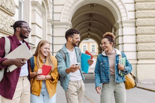 istock Multi-ethnic group of University students hanging out after class 1482680591