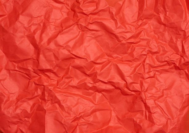 istock Crumpled red paper sheet, paper texture. Background for designers 1482687104