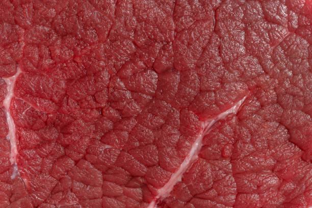 istock Texture of a red piece of beef, macro 1482690833