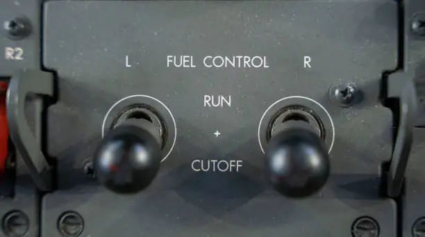 Close up on the fuel control panel in the flight deck of a 787 commercial aircraft.