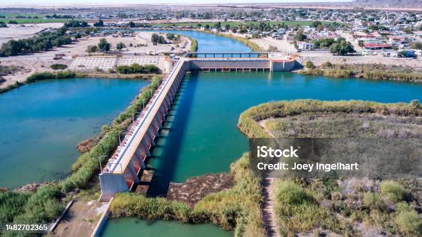 Drone View Of The Colorado Diversion Dam River Drainage At International Barrier Between Yuma Arizona And Algodones Near The International Border Wall Baja California Norte Mexico On A Sunny Day Stock Photo - Download Image Now