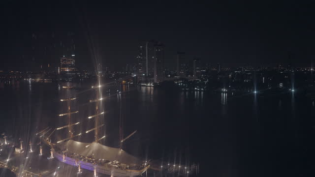 Night view of Bangkok skyline, artificial lights blurry