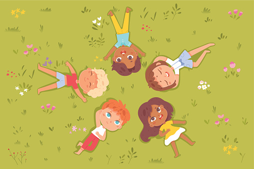 Children lying on green summer grass and looking up, top view vector illustration. Cartoon happy girls and boys playing in playground or lawn background. International kids day, friendship concept