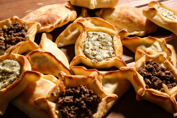 istock Assorted Mixed Fatayer with Labneh, Zataar, Mortadella, jibin, Mozzarella, Rahash, chocolate, Sabanikh and sujuk baked isolated background top view arabic food 1482704537
