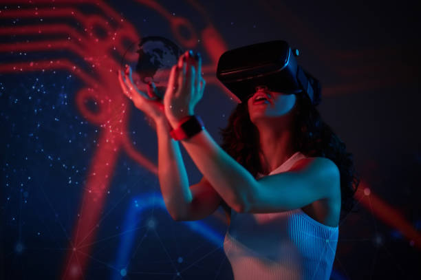 istock Young woman looking entertained while wearing vr simulator 1482704561