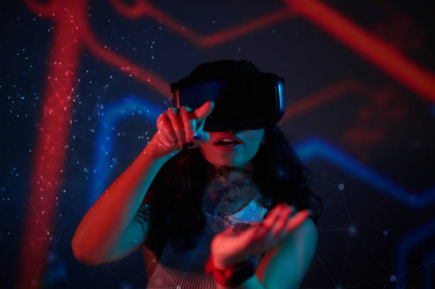 istock Young woman looking entertained while wearing vr simulator 1482704574