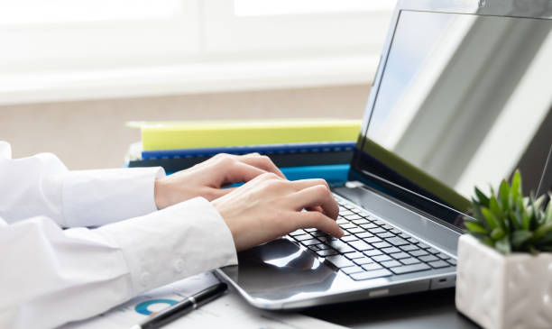 istock Woman working at home or office. Hand on keyboard. Close up. Workplace 1482704643