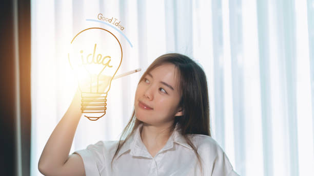 istock A woman is drawing a light bulb with a good today logo on it. 1482705311