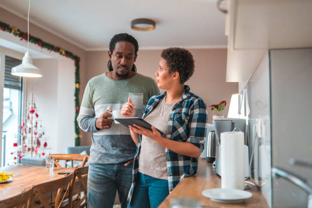 istock Hispanic Male And Mixed Race Female In 30s Hanging Out  Using A Digital Tablet 1482706333