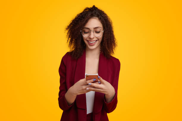 istock Cheerful ethnic woman using smartphone 1482706460
