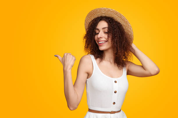 istock Trendy female pointing away with thumb 1482706473