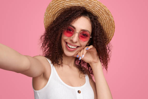 istock Content woman taking self shot in studio 1482706514