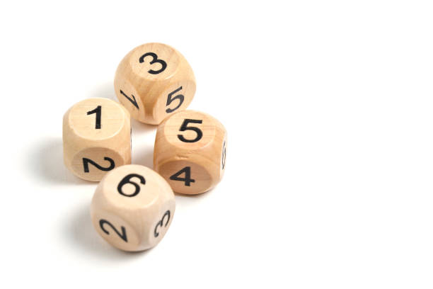 istock Four wooden cubes with numbers for board games with a white background. 1482710681