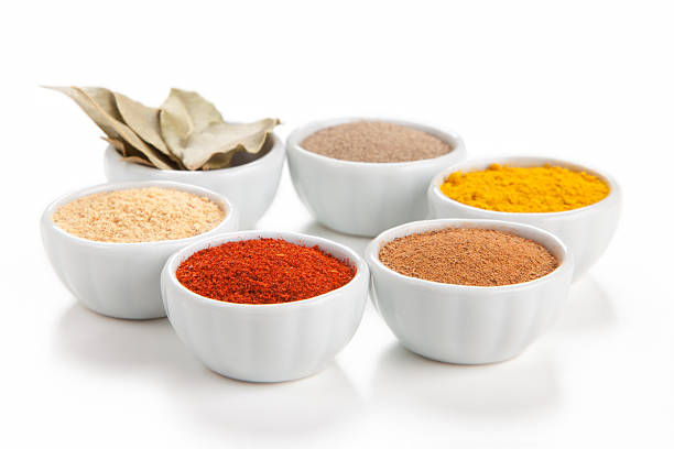 istock Different spices in bowls isolated on white background. 148271085