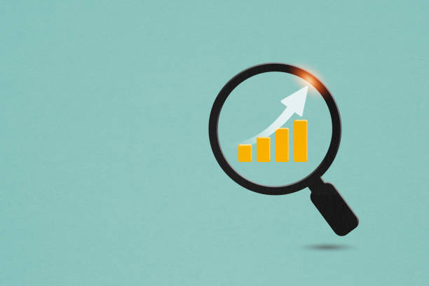 istock For business strategy concept. paper cut of increasing graph inside magnifying glass on grunge green background including copy space 1482713541