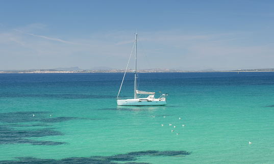 Sailboat in the Mediterranean Sea off the island of Tabarca, Alicante.