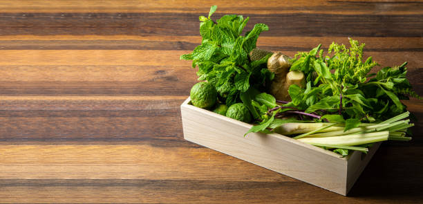 istock Various fresh asian herbs ingredients food in box on wooden table 1482720163