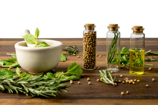 istock green herbs in mortar with essential oil on wooden table 1482720195