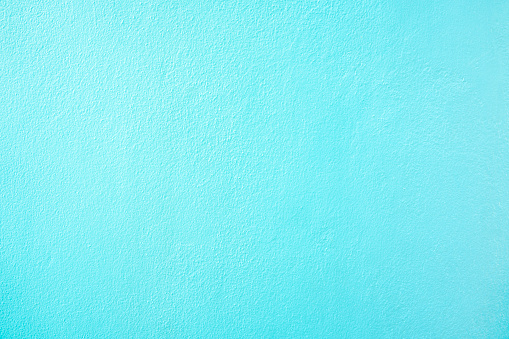 Rough rendered turquoise wall texture as background.