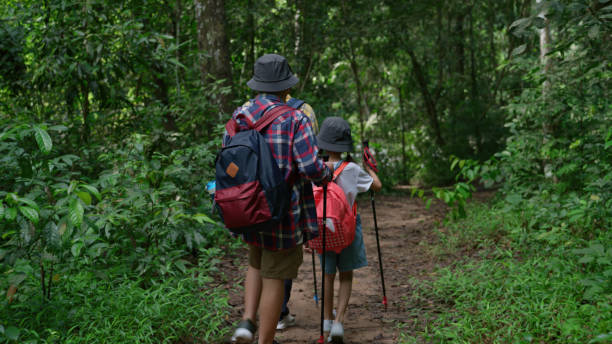 istock Asian family hiking, exploration, and Learning about Nature 1482730090