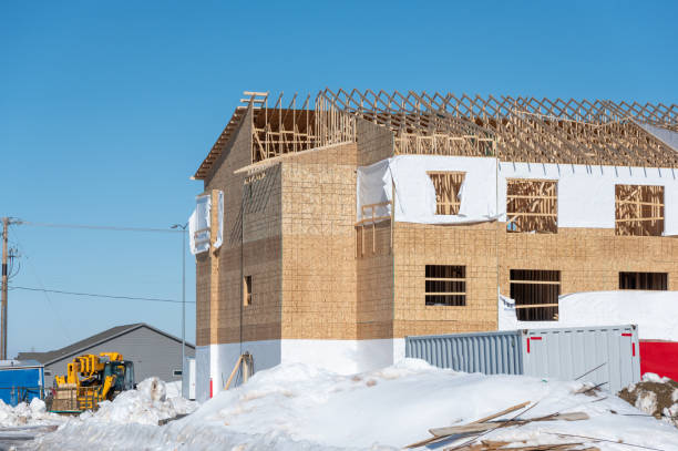 istock Ground level view of a multifamily apartment complex under construction in winter. 1482730771