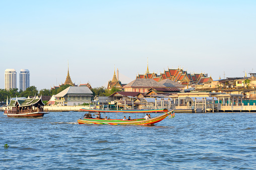 Bangkok, Thailand - december 10 2022: taxi boat on chaopraya river public transporation and tourist sightseeing at bangkok thailand
