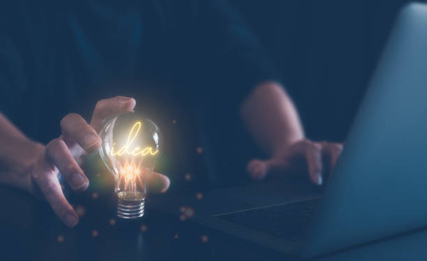 istock idea creativity concept, man holding light bulb with word idea, inspiration and innovation new technology 1482742945